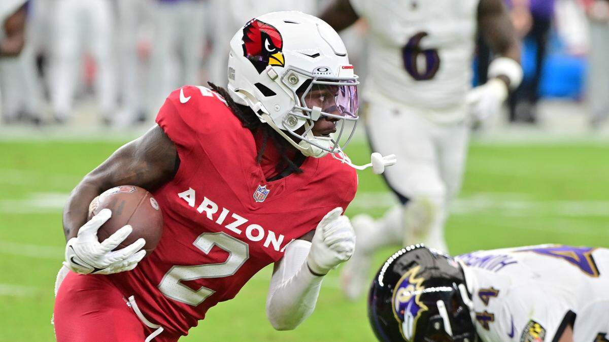 Arizona Cardinals wide receiver Marquise Brown (2) runs with the ball as Baltimore Ravens cornerback Marlon Humphrey (44) defends in the first half at State Farm Stadium.