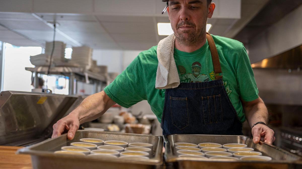 Shaun Brady, chef and co-owner of Brady and Fox, is seen in a file photo preparing creme brúlées at Brady & Fox in East Brookside on Friday, March 25, 2022. Brady was shot and killed outside his restaurant Wednesday.