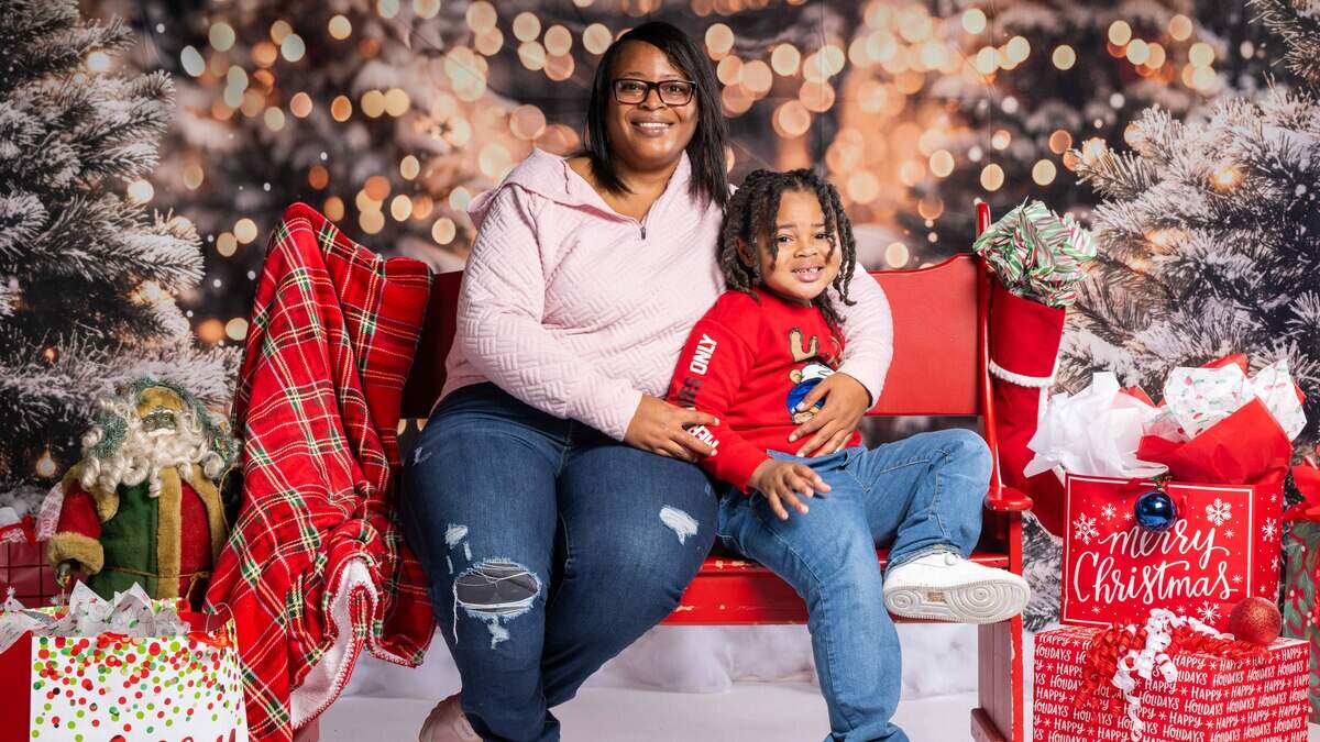 Joylisa McClendon and her 4-year-old son Jyaire Ross posed for a family portrait at the Soul of Santa Christmas breakfast at the Linwood YMCA on Saturday, December 6, 2025.
