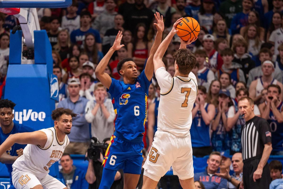 Kansas Jayhawks guard Rylan Griffen jumps to contest a jumper from Buffaloes forward Sebastian Rancid in the second half of the Jayhawks game vs. the Colorado Buffaloes on Tuesday, Feb. 11, 2025, at Allen Fieldhouse.