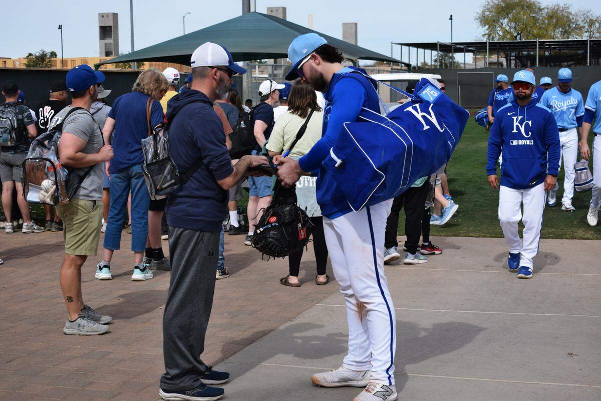 Kansas City Royals prospect Blake Mitchell signs autographs for fans at the Royals spring training complex in Surprise, Arizona on Feb. 17, 2025.