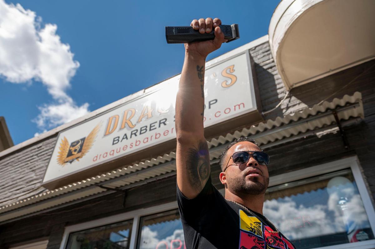 “Having money on the line made watching the game so much more exciting. The first big win was for like $2,000​, and kept going after that,” says Draque Murff, holding one of his favorite hair clippers outside his Kansas City barbershop.