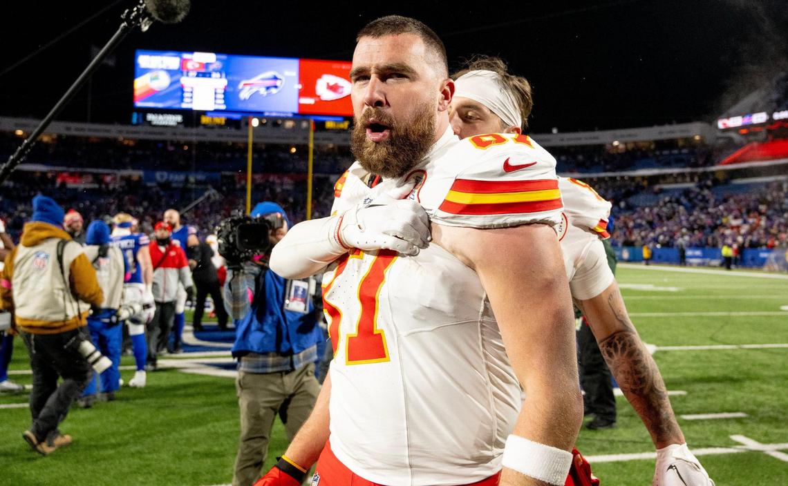 Kansas City Chiefs tight end Travis Kelce (87) celebrates with tight end Noah Gray (83) after the Chiefs defeated the Buffalo Bills 27-24 during an AFC Divisional Round playoff game at Highmark Stadium on Sunday, Jan. 21, 2024, in Orchard Park, New York.