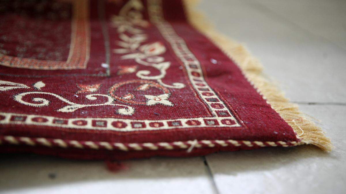 A red and gold rug.