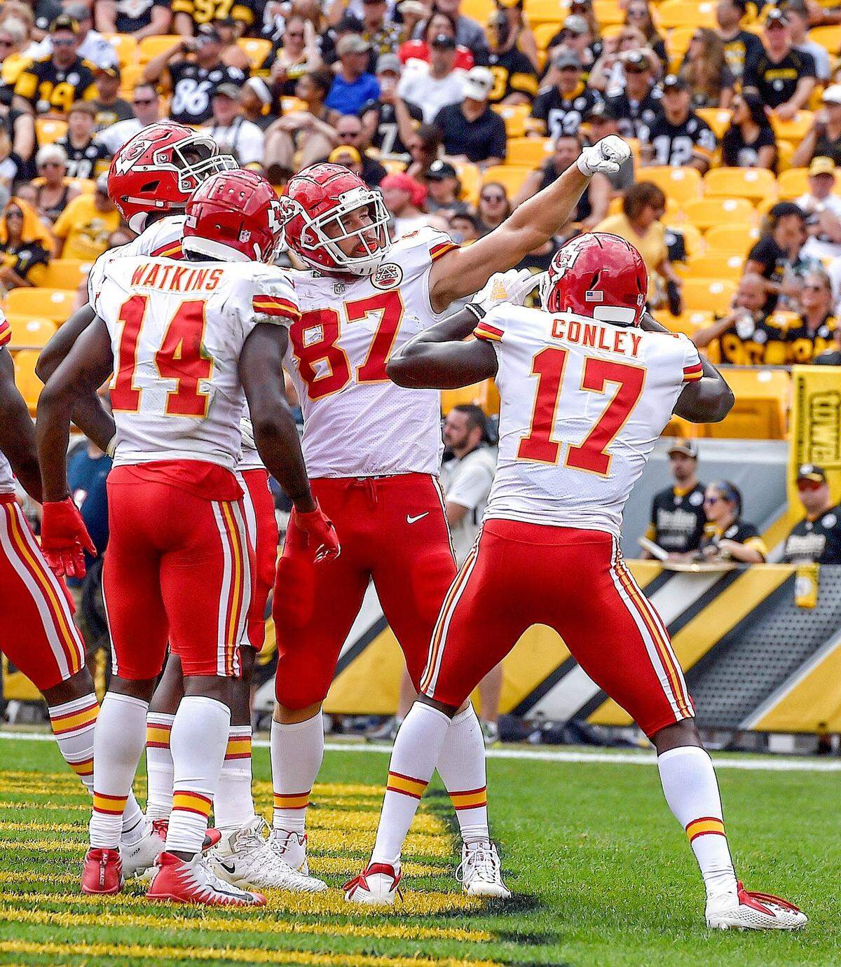 When Kansas City Chiefs tight end Travis Kelce snagged a 25-yard pass reception from Chiefs quarterback Patrick Mahomes against the Steelers in Pittsburgh on January 10, 2019, Kelce celebrated with a Usain Bolt-style pose while teammates pretended to photograph the moment.  
