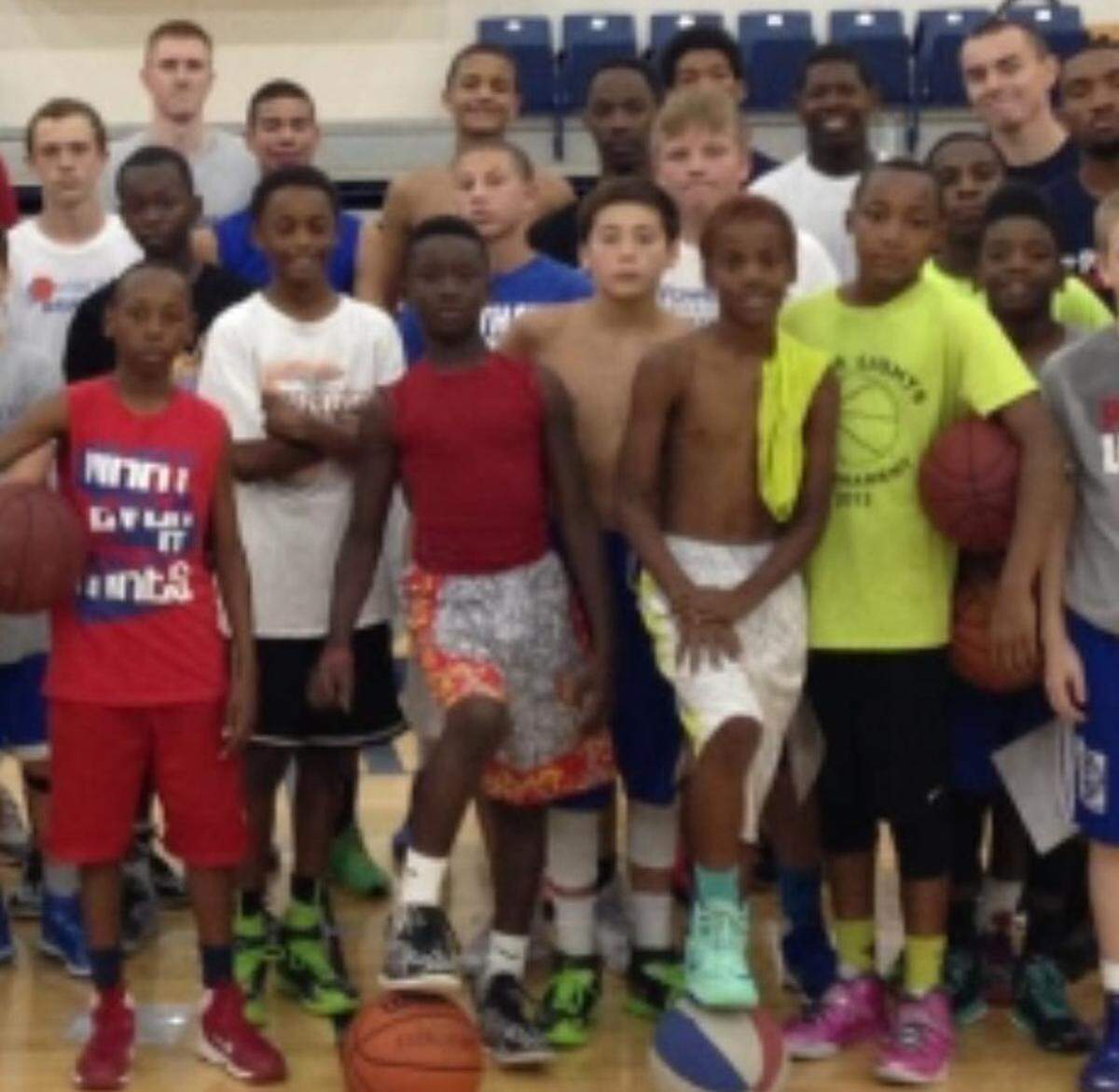 Pictured here as kids with their young KC-area teammates are three current Missouri Tigers men’s basketball players. Participating in a sixth- or seventh-grade basketball camp around 2016 at MidAmerica Nazarene University in Olathe were: (in yellow, holding ball) Tamar Bates; Aidan Shaw (wearing a white shirt with his arms crossed) and Mark Mitchell (right behind Shaw, in the back row).