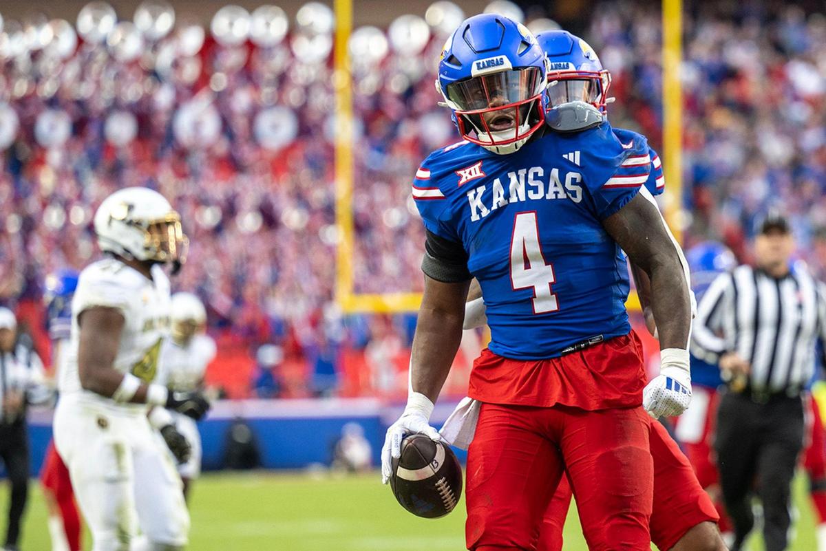 Kansas Jayhawks running back Devin Neal (4) was pumped up after a 37-yard run during the second half against the Colorado Buffaloes at GEHA Field at Arrowhead Stadium on Saturday, Nov. 23, 2024, in Kansas City.