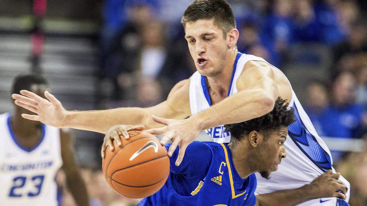 Creighton’s Martin Krampelj knocks the ball loose from UMKC’s Xavier Bishop during an NCAA college basketball game Thursday, Dec. 27, 2018, in Omaha, Neb. (Chris Machian/Omaha World-Herald via AP)