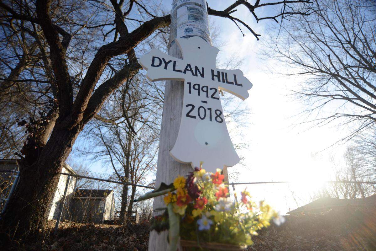 Relatives of Dylan Hill, 26, pinned a cross to a light pole near where he was fatally shot in December 2018 at East 80th Terrace and James A. Reed Road in Kansas City.