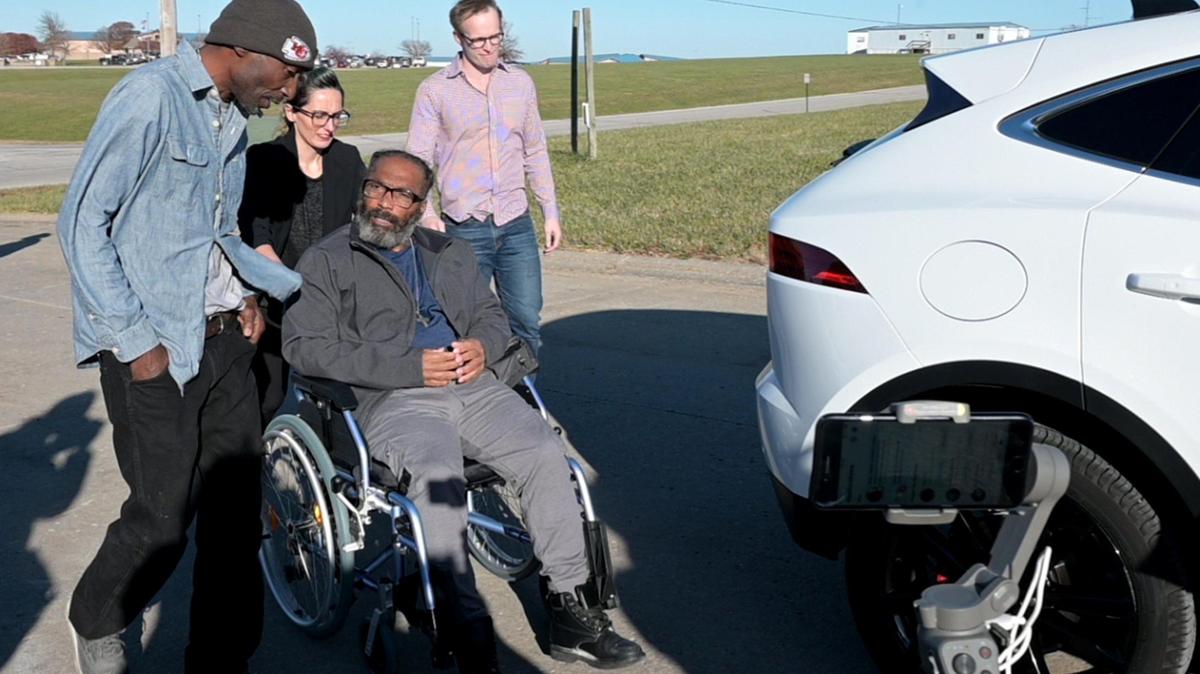 After 43 years in prison for a wrongful incarceration, Kevin Strickland was released from prison on Tuesday, Nov. 23, 2021 in Cameron, Missouri, where attorney Tricia Rojo Bushnell of the Midwest Innocence Project wheeled him to a car as he spoke with fellow exoneree Robert Nelson, left, who was freed after spending nearly 30 years in Missouri prisons.