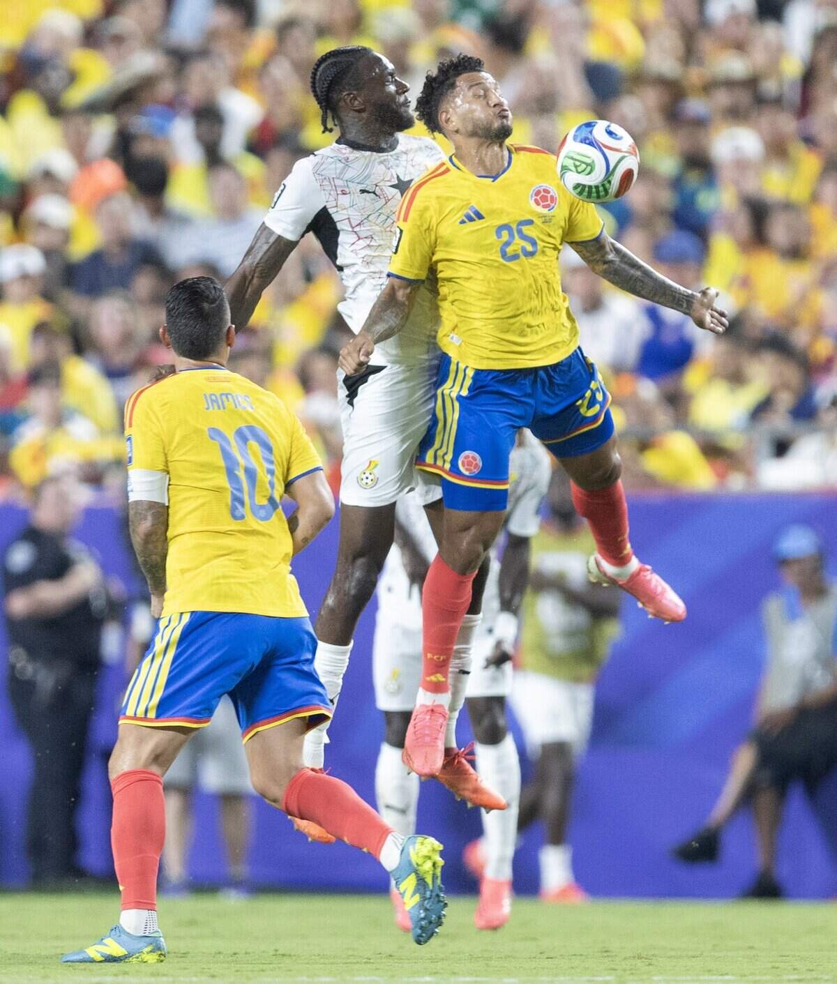 Ghana defender Jerome Opoku (18)challenges Colombia forward Luis Suárez (25) for the ball during a FIFA World Cup knockout stage soccer match at Kansas City (Arrowhead) Stadium in Kansas City on Friday, July 3, 2026.