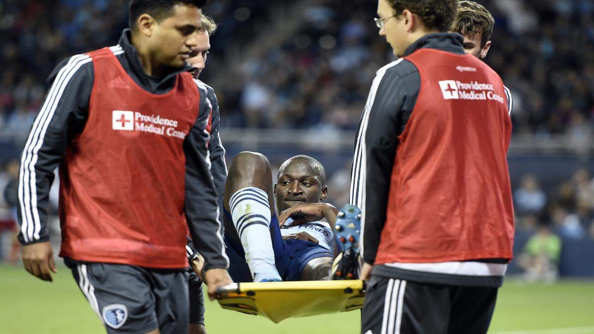 Sporting KC's Ike Opara is carried off the field after injuring himself during the second half of Saturday night's match at Sporting Park.