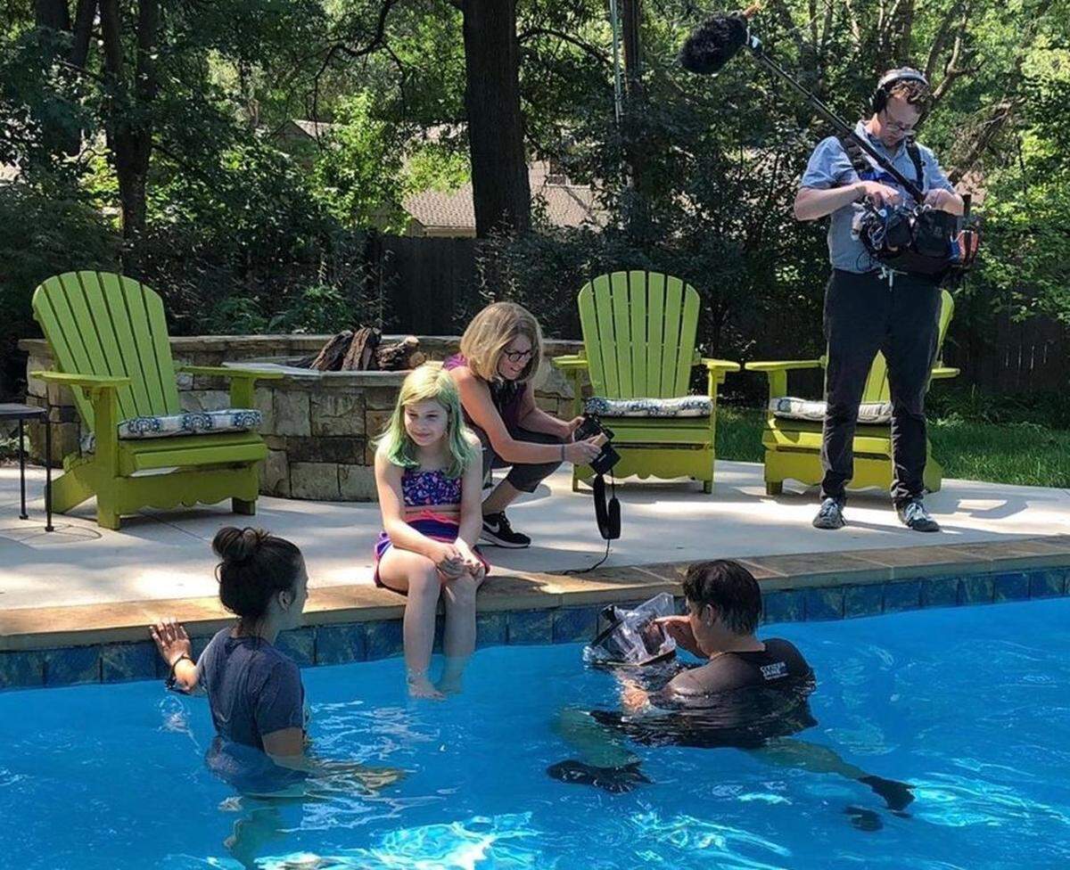 Filmmaker Sharon Liese (crouching) spent five years filming her transgender subjects, including preteen Avery Jackson of south Kansas City.