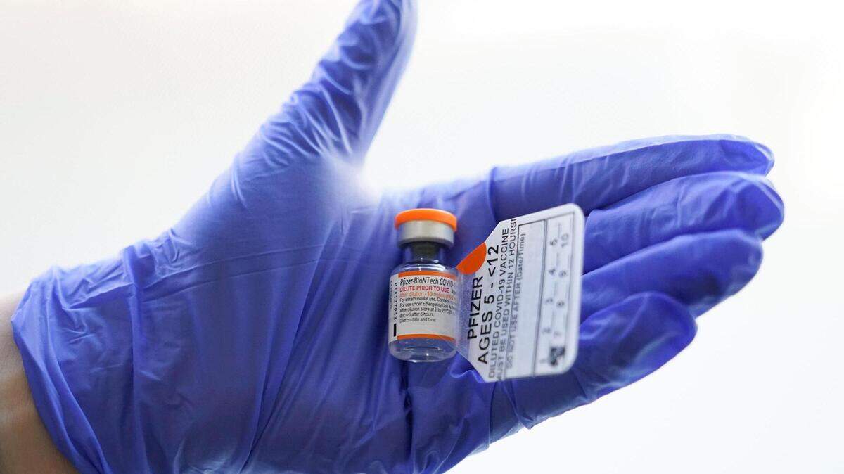 An RN holds a vial with the Pfizer-BioNTech COVID-19 vaccine for children five to 12 years at The Children’s Hospital at Montefiore in New York City last month.