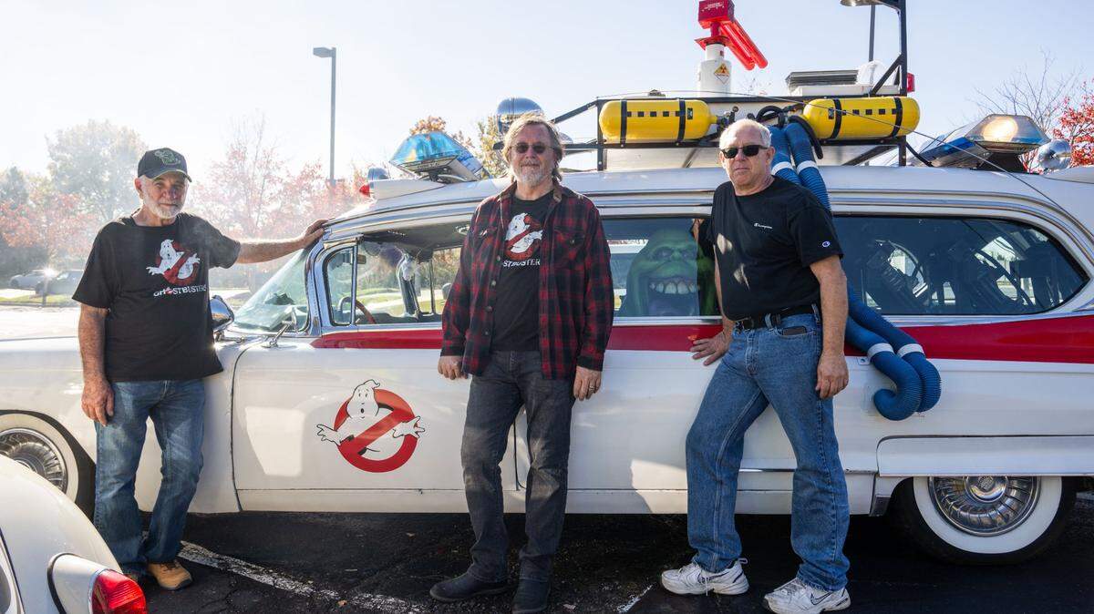 Russell Dameron, center, with brother Rod Dameron, left, and cousin Rodney Creed converted an old Cadillac hearse into an exact replica of the Ecto-1 vehicle that was a big part of the “Ghostbusters” movies. Russell Dameron and his family have been collecting and refurbishing cars to appear movie accurate.