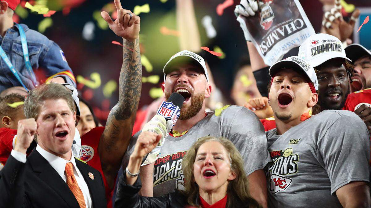 Kansas City Chiefs tight end Travis Kelce (center) celebrates with quarterback Patrick Mahomes (right) and team owner Clark Hunt after defeating the San Francisco 49ers in Super Bowl LIV at Hard Rock Stadium on Feb. 2, 2020.