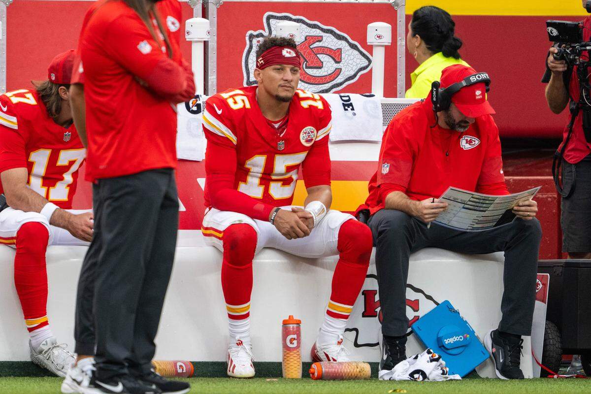 Kansas City Chiefs quarterback Patrick Mahomes (15) sits on the sideline late in the second half of the Chiefs game vs. the Philadelphia Eagles on Sunday, Sep. 14, 2025, at GEHA Field at Arrowhead Stadium.