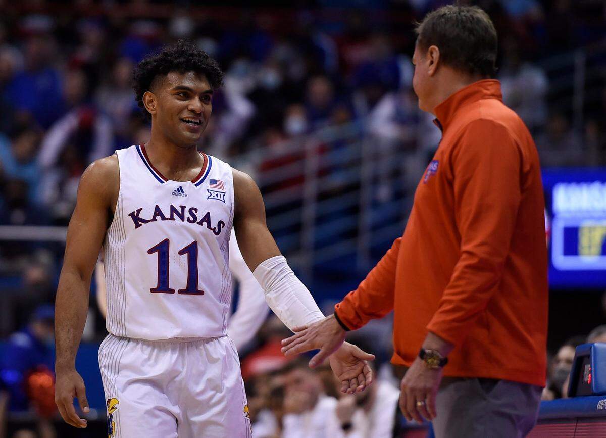 KU’s Remy Martin had 10 points and a smile for Jayhawks head coach Bill Self during the second half of Saturday’s game at Allen Fieldhouse. KU beat Missouri, 102-65.