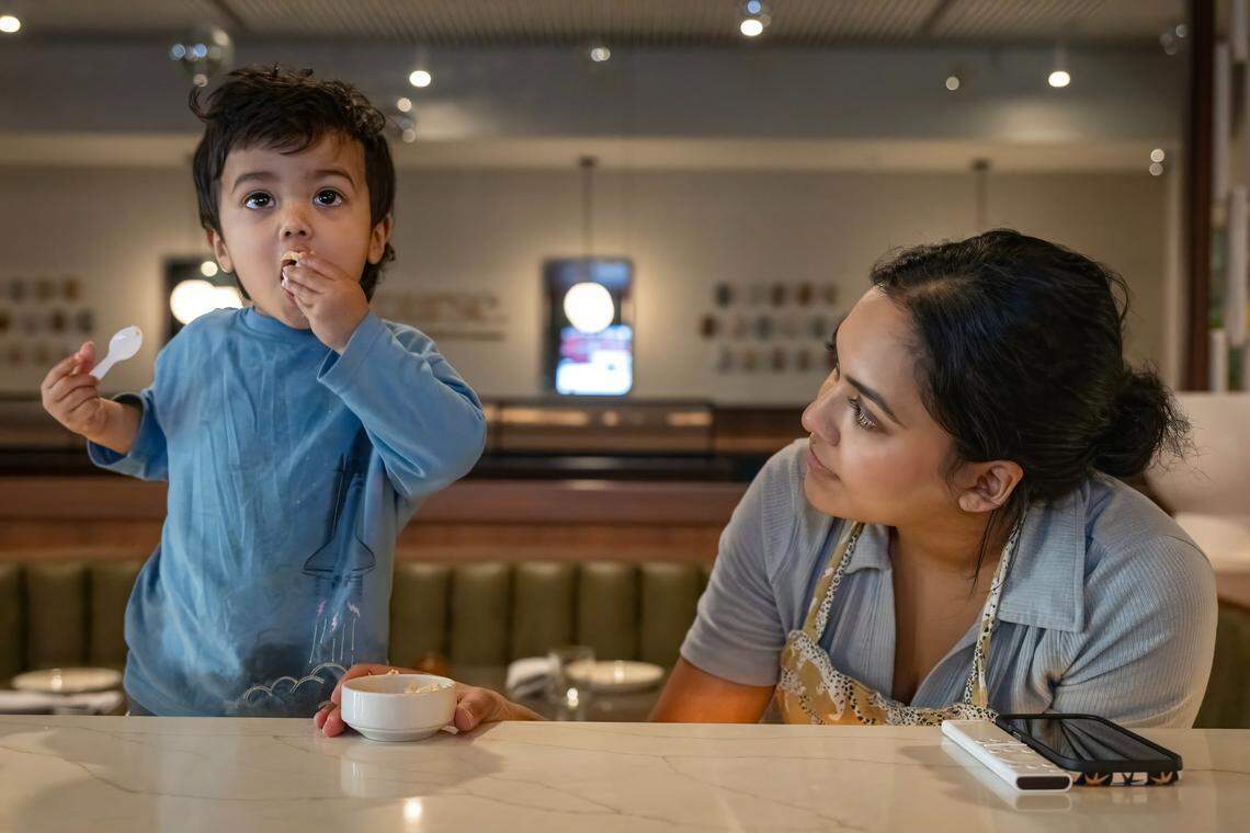 “Just raising a child is what it feels like,” said chef/owner Swetha Newcomb, of Of Course Kitchen & Co., as she sat with her 20-month-old son, Zev, at the restaurant's bar in Overland Park on Wednesday, Feb. 25, 2026. “I would say that owning a restaurant is harder for me than being a mom.” Newcomb, 31, is a James Beard Best Chef: Midwest nominee.