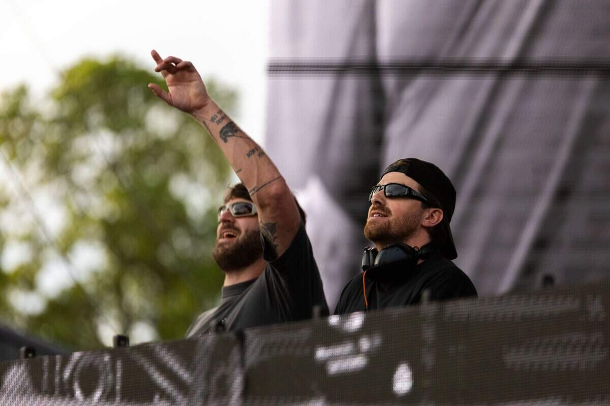 The Chainsmokers mix beats and pump their arms on stage during their FIFA Fan Fest concert at Fan Fest on Sunday, June 21, 2026.