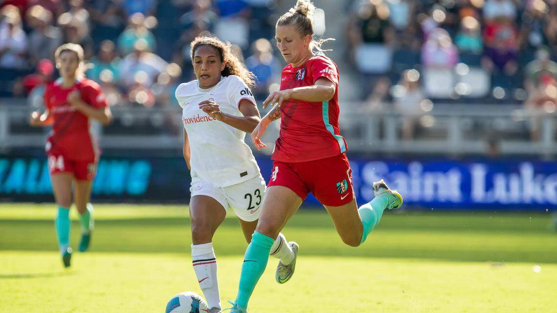 KC Current defender Hailie Mace, right, races ahead of a Portland Thorns defender during a game at Children’s Mercy Park in Kansas City, Kansas this season.