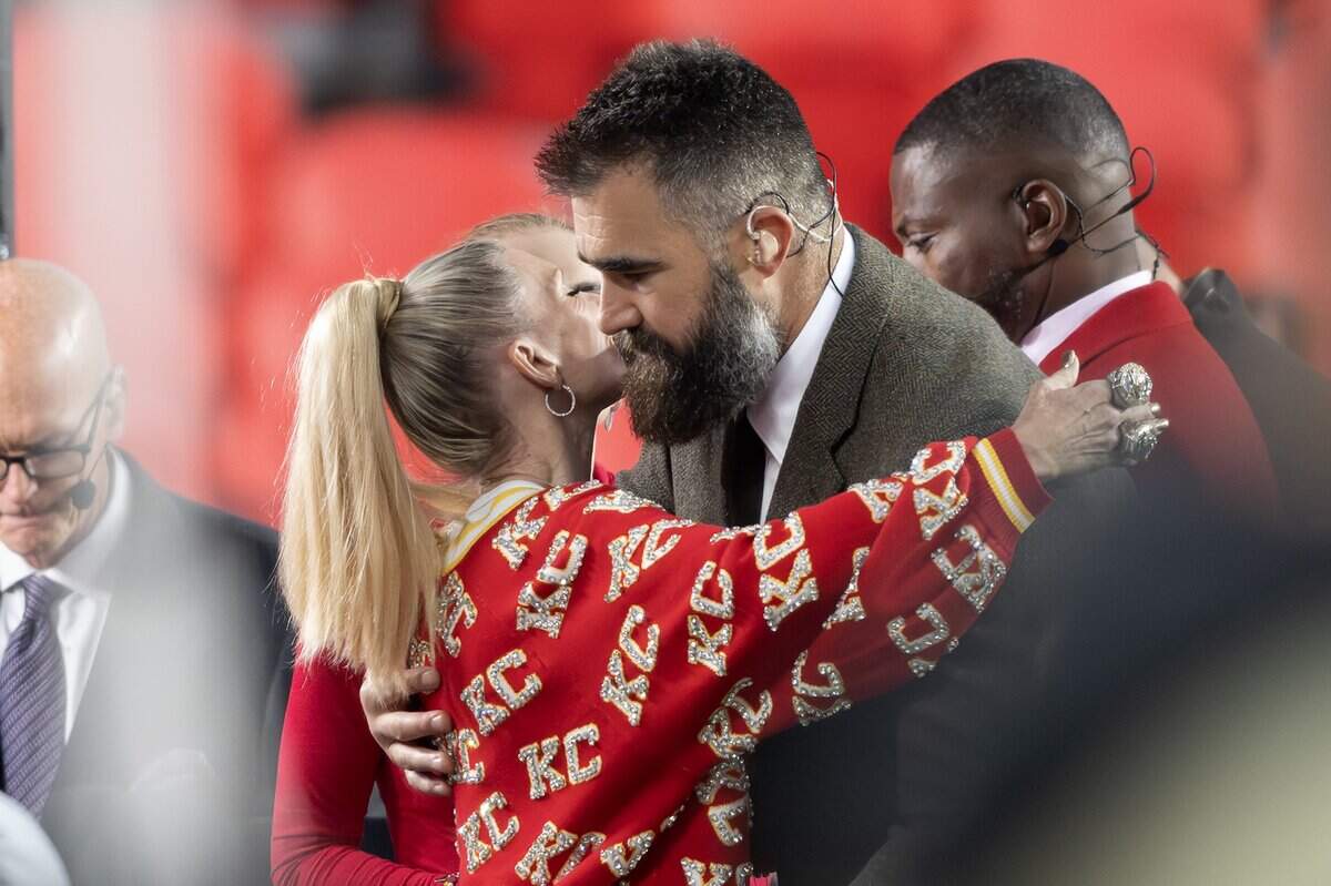 Former Philadelphia Eagles center Jason Kelce embraces Kansas City Chiefs head coach Andy Reid's wife, Tammy, before the Kansas City Chiefs-Washington Commanders game at GEHA Field at Arrowhead Stadium on Monday, Oct. 27, 2025.