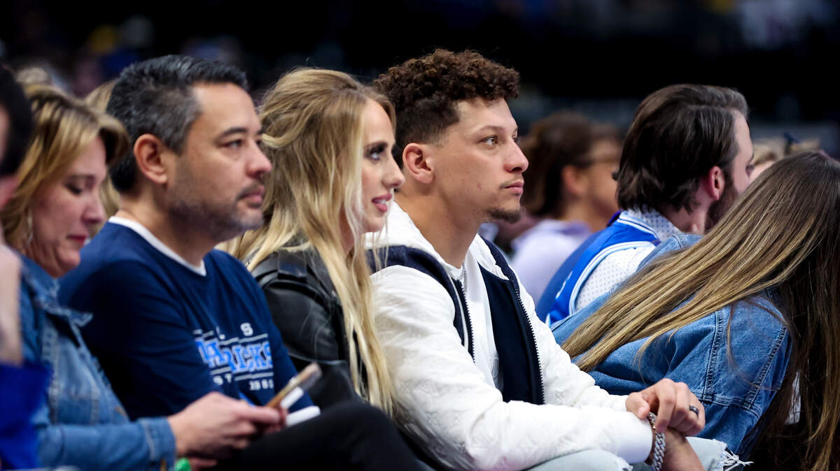 Kansas City Chiefs quarterback Patrick Mahomes sits with wife Brittany Mahomes during the game between the Dallas Mavericks and Los Angeles Lakers at American Airlines Center in Dallas on Feb. 26, 2023.