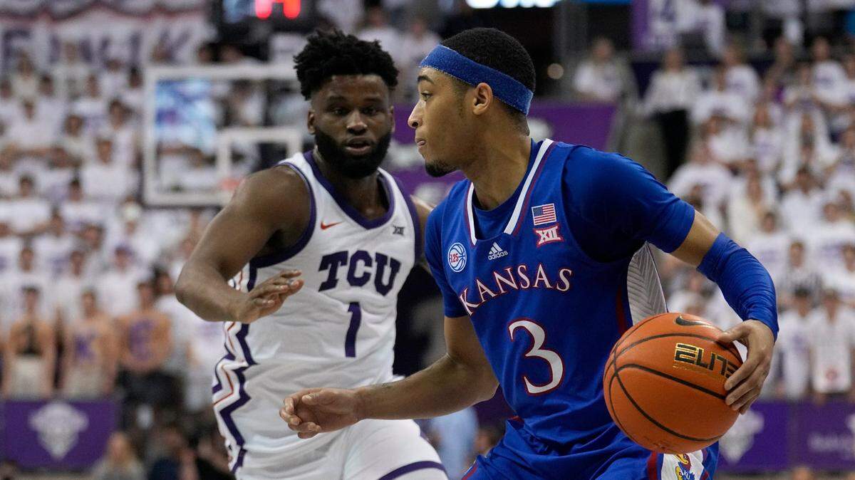 Kansas guard Dajuan Harris Jr. looks for an opening to the basket as TCU’s Mike Miles Jr. defends in the first half of a game on Feb. 20, 2023, in Fort Worth, Texas.