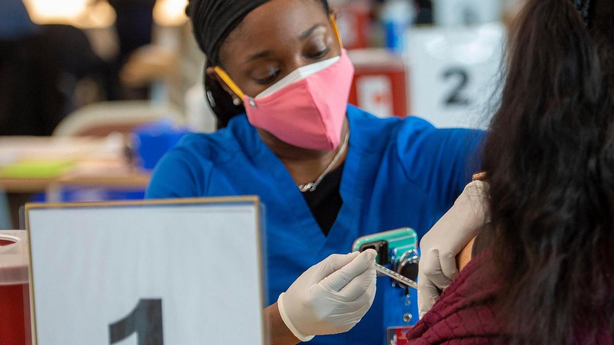Kansas City University medical student Alexis Joye-King administered a second dose of the Pfizer COVID-19 vaccine on Friday, Feb. 11, 2021, during a vaccination clinic held for people who pre-registered with the Kansas City Health Department.