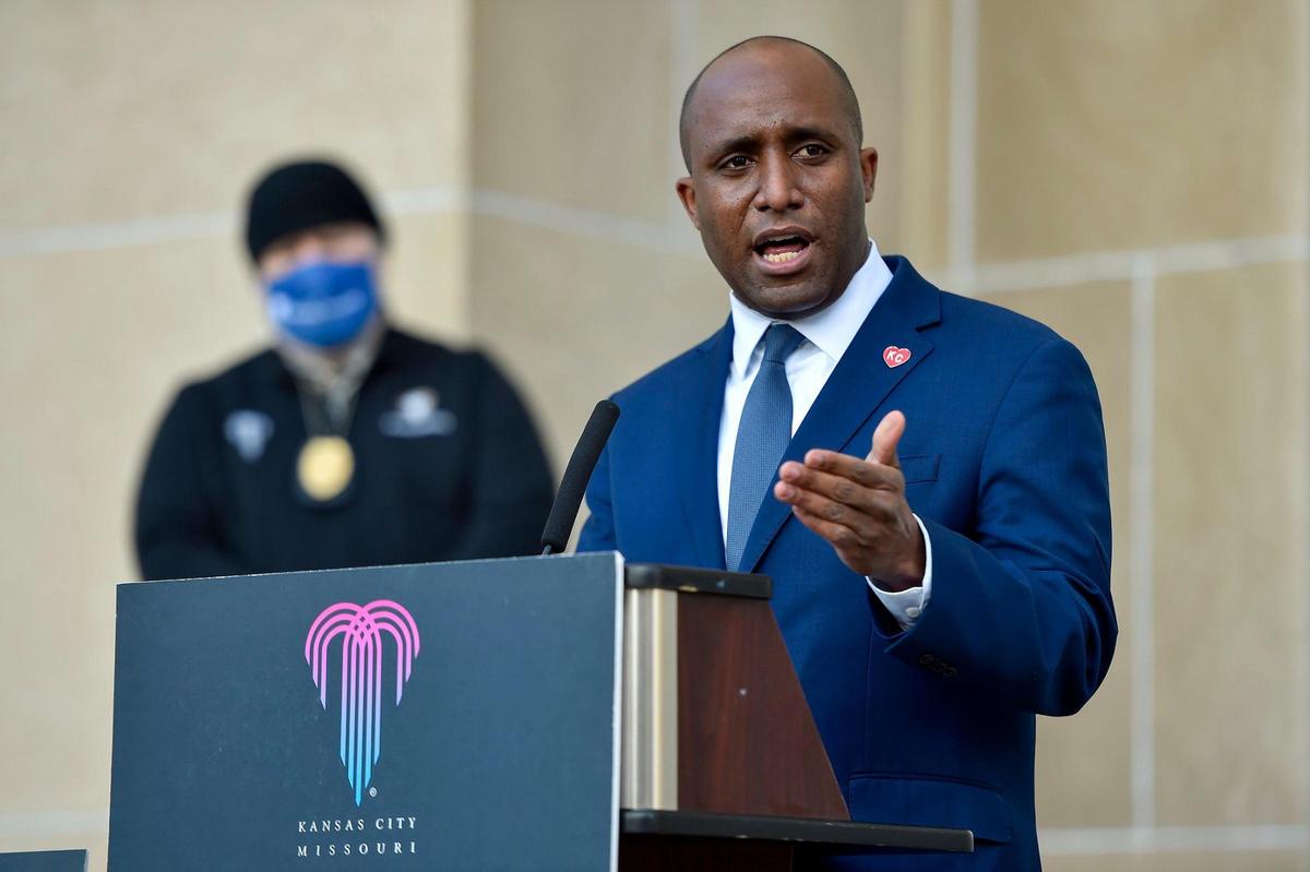 Kansas City Mayor Quinton Lucas announced an extension of the COVID-19 emergency order to May 1 and eased closing times for bars and restaurants to midnight. Lucas, with Rex Archer, health department director, left, made the announcement at a press conference outside City Hall on Wednesday, Jan. 13, 2021.