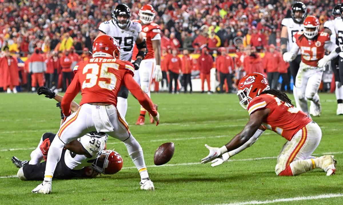 Kansas City Chiefs linebacker Nick Bolton, right, dives for a fumble by Jacksonville Jaguars wide receiver Jamal Agnew inside the 5 yard line in the fourth quarter during the Divisional Round game Saturday, Jan. 21, 2023 at GEHA Field at Arrowhead Stadium.