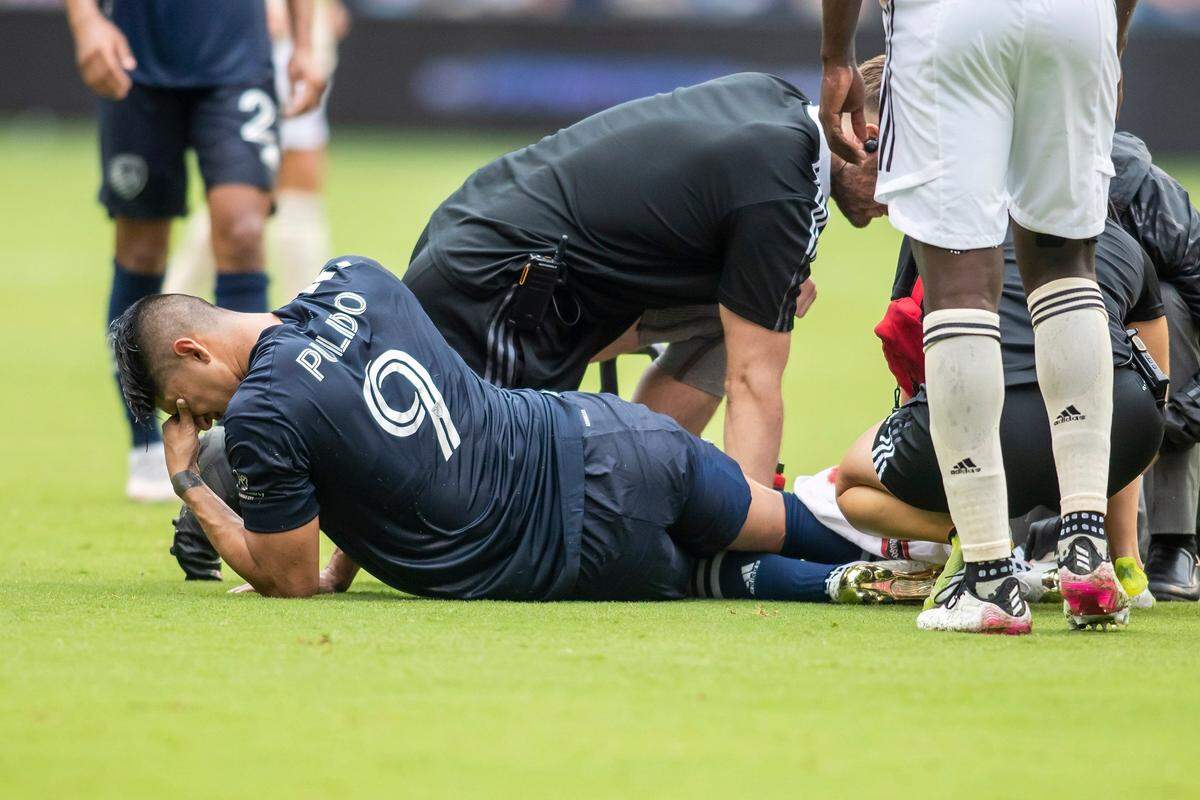 In an awful scene from June 2021, forward Alan Pulido of Sporting KC lies on the field after injuring his knee during a match against LAFC at Children’s Mercy Park in Kansas City, Kan.