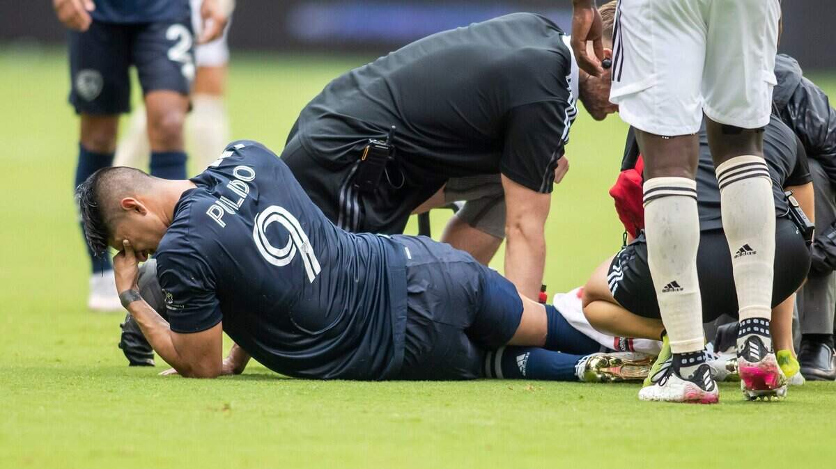 Forward Alan Pulido of Sporting KC lies on the field after injuring his knee during a match against LAFC in June 2021. A soccer knee injury, when it involves a torn ligament, can require surgery, depending on the tear and which of the four main ligaments of the knee.