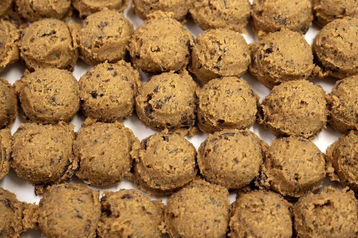 Scooped cookie dough rests on a baking tray at Sister Anne's Coffee and Records Thursday, Dec. 4, 2025, in Kansas City.