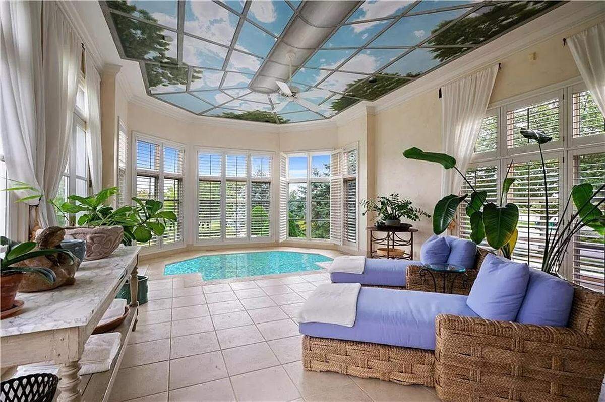 The indoor spa of 2404 W. 114th St. is surrounded by windows.