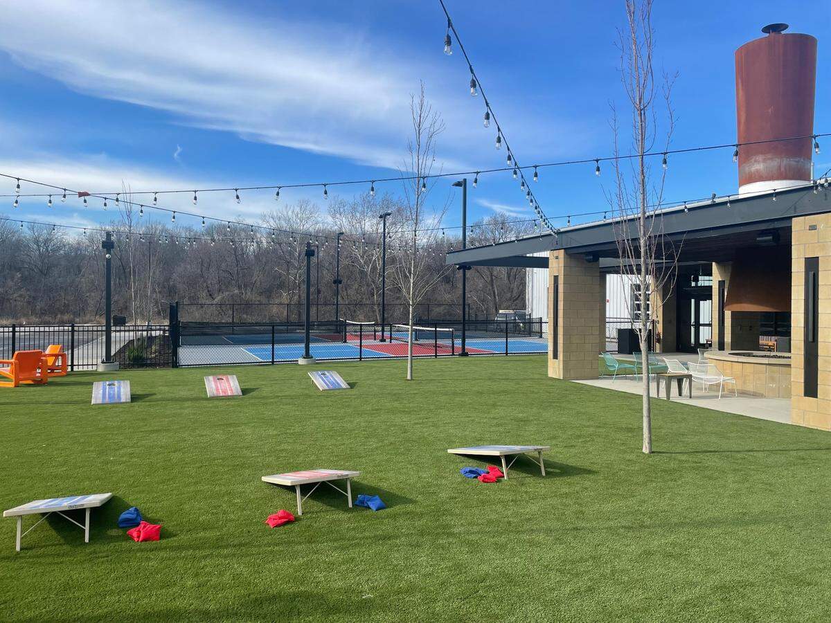 In addition to a large patio and lawn for yard games like cornhole, the Parkville Char Bar features two outdoor and four indoor pickleball courts.