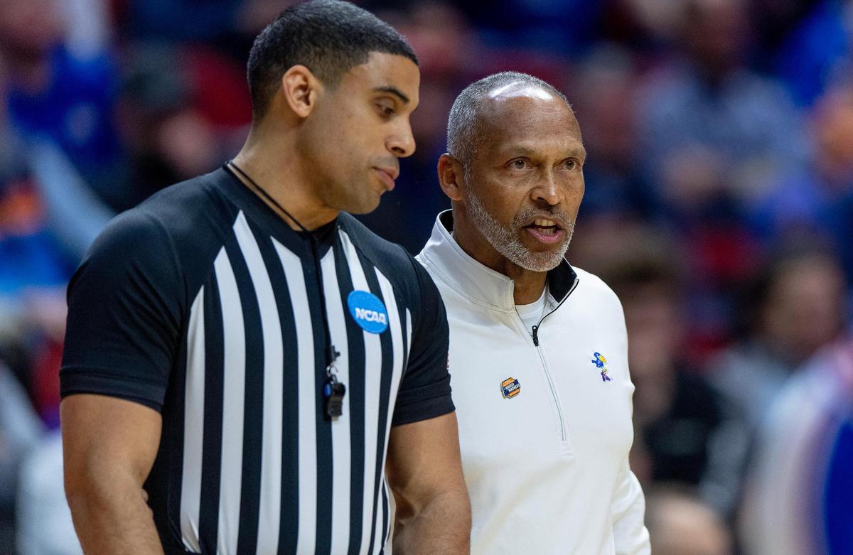 Acting Kansas head coach Norm Roberts argues a call during a second-round college basketball game against Arkansas in the NCAA Tournament Saturday, March 18, 2023, in Des Moines, Iowa.