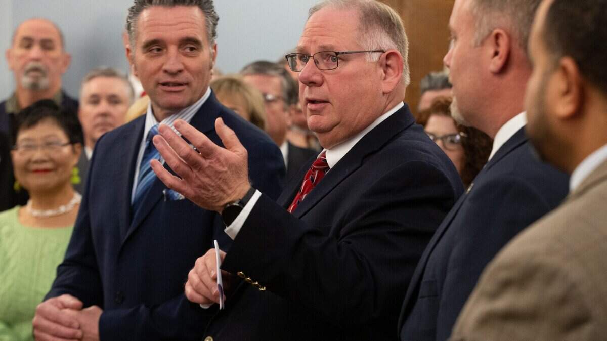 Kansas House Speaker Rep. Dan Hawkins, center, speaks as Kansas Senate President Ty Masterson, left, looks on. Republicans preserved supermajorities in both chambers of the Kansas Legislature in the 2024 election.
