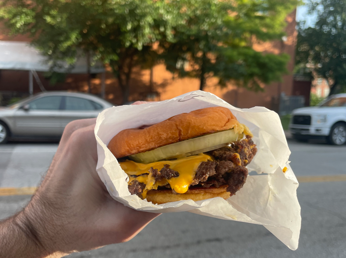 A double Disco Burger (beef, cheese, onion, pickles, disco sauce) from Disco Burger.