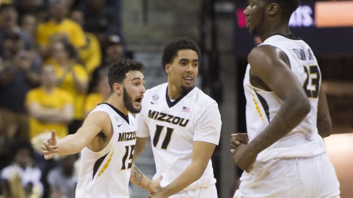 Missouri Tigers guard Jordan Geist (15) and Missouri Tigers forward Jontay Porter (11) celebrated scoring in the second half during the University of Missouri and University of Arkansas Southeastern Conference basketball game at Mizzou Arena on Saturday, March 3, 2018, in Columbia, Missouri.