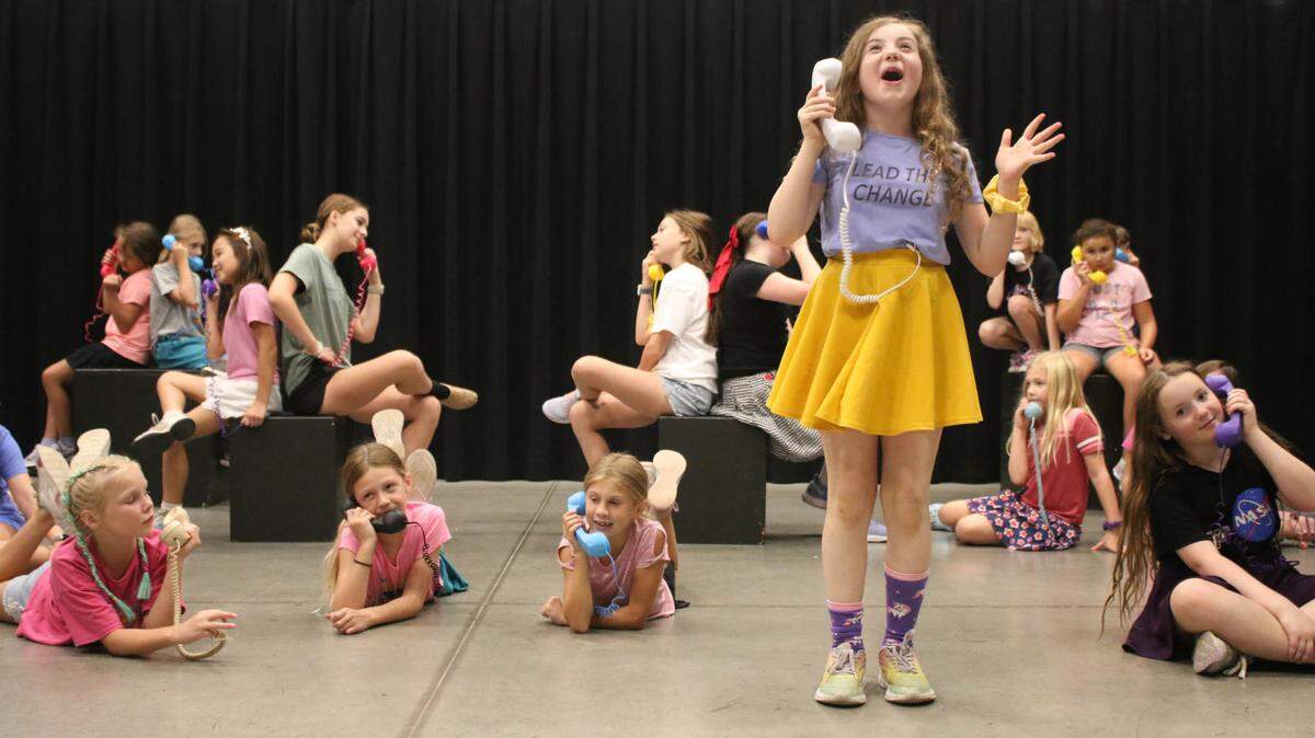 Laila Bringman, Vivian Griffith, Ruthie Brown, Sophia Huenefeldt listen as Helen Huendfeldt performs a short solo during their Broadway workshop camp’s performance of “The Telephone Hour” from “Bye Bye Birdie.”