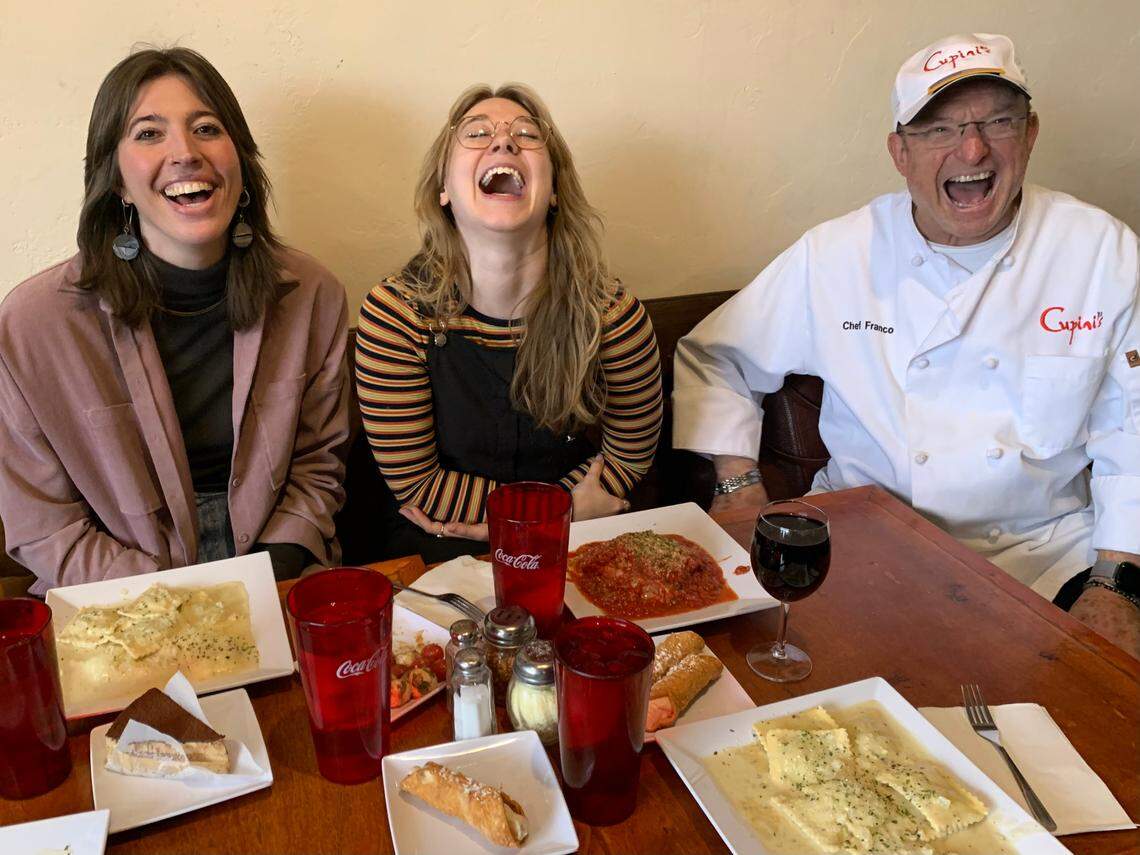 My friends Kat King, left, Kat Lip and co-owner Franco Cupini delighting in the pasta on the table at Cupini’s for lunch.