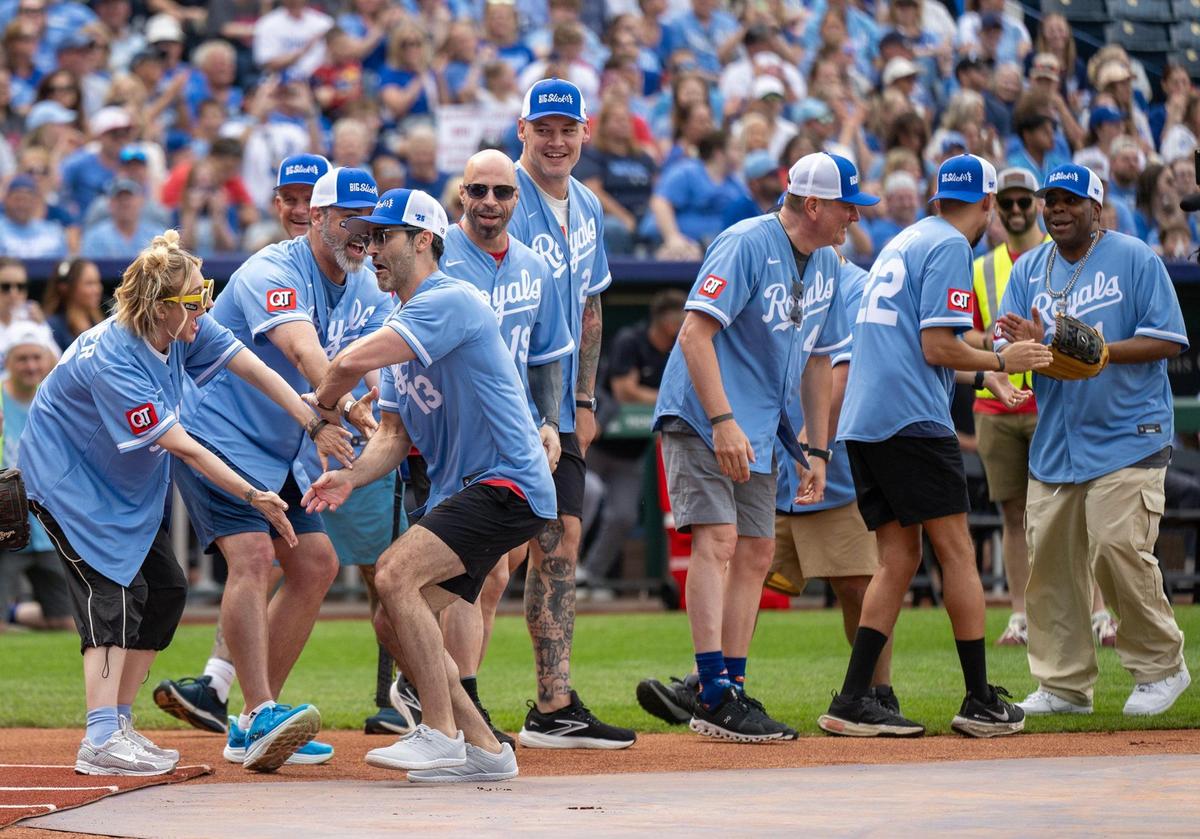 Heidi Gardner greets Sal Vulcano, (13) comedian and actor, as he celebrates a home run during the Big Slick Celebrity Softball game on Friday, May 30, 2025, at Kauffman Stadium in Kansas City.
