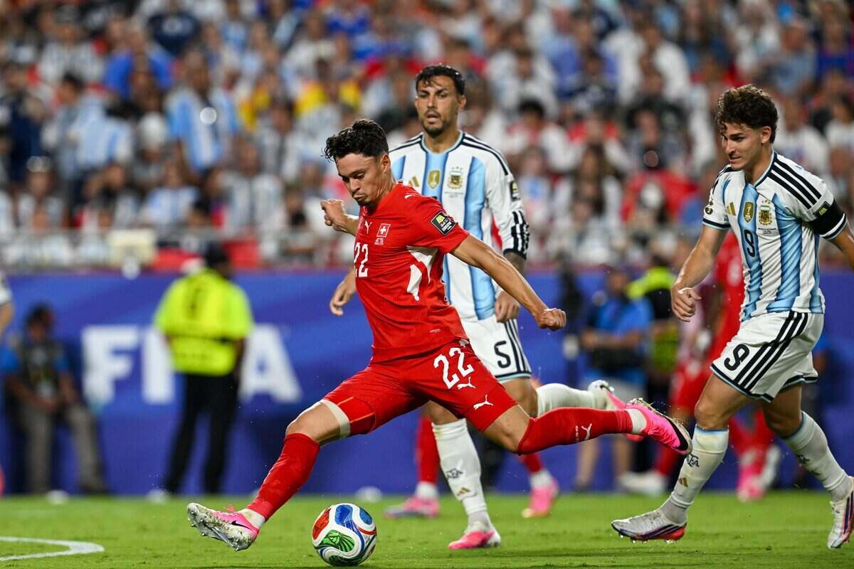 Switzerland midfielder Fabian Rieder (22) kicks the ball down the pitch in the Argentina vs. Switzerland 2026 World Cup Quarterfinal football match at Kansas City (Arrowhead) Stadium in Kansas City on Saturday, July 11, 2026.