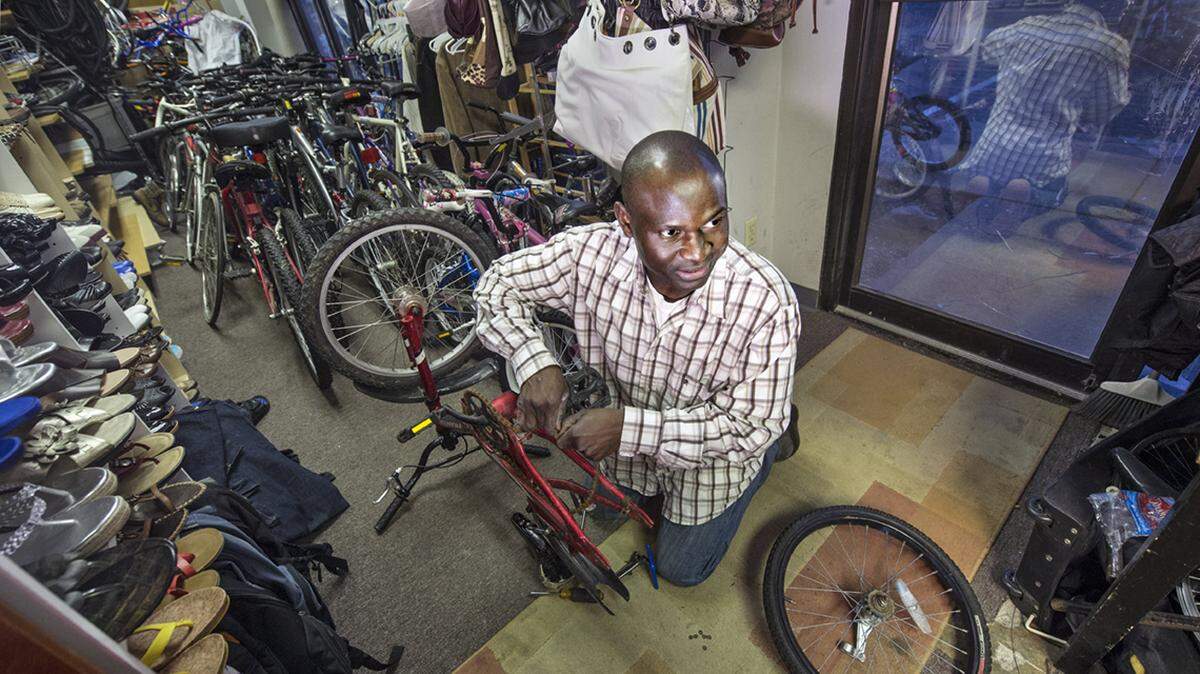 Abdoulie Fatajo in his Hy-5 Traders store in Shawnee.