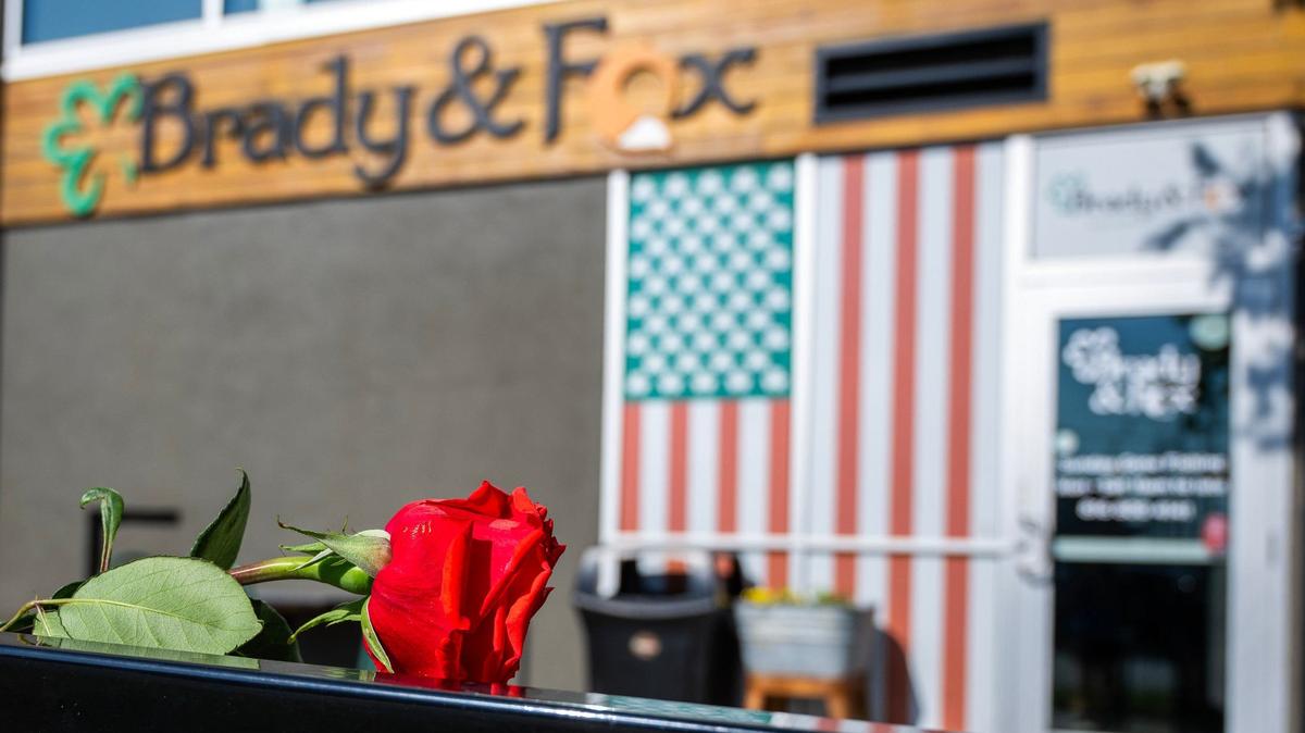 A red rose is seen near the entrance of Brady & Fox restaurant on Thursday in Kansas City. Shaun Brady, the restaurant’s owner, was shot and killed Wednesday night outside of his restaurant at 63rd Street and Rockhill Road in the Brookside neighborhood.