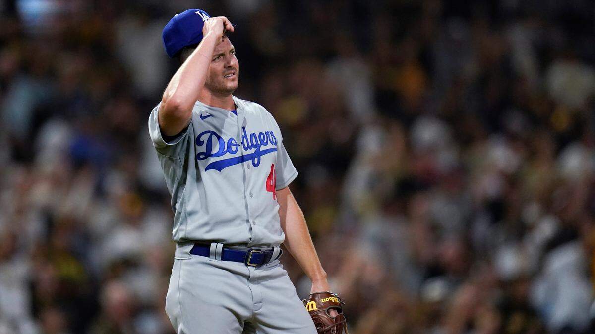 Los Angeles Dodgers relief pitcher Corey Knebel waits after giving up a home run to San Diego Padres’ Jurickson Profar during the eighth inning of a baseball game Tuesday, Aug. 24, 2021, in San Diego. (AP Photo/Gregory Bull)