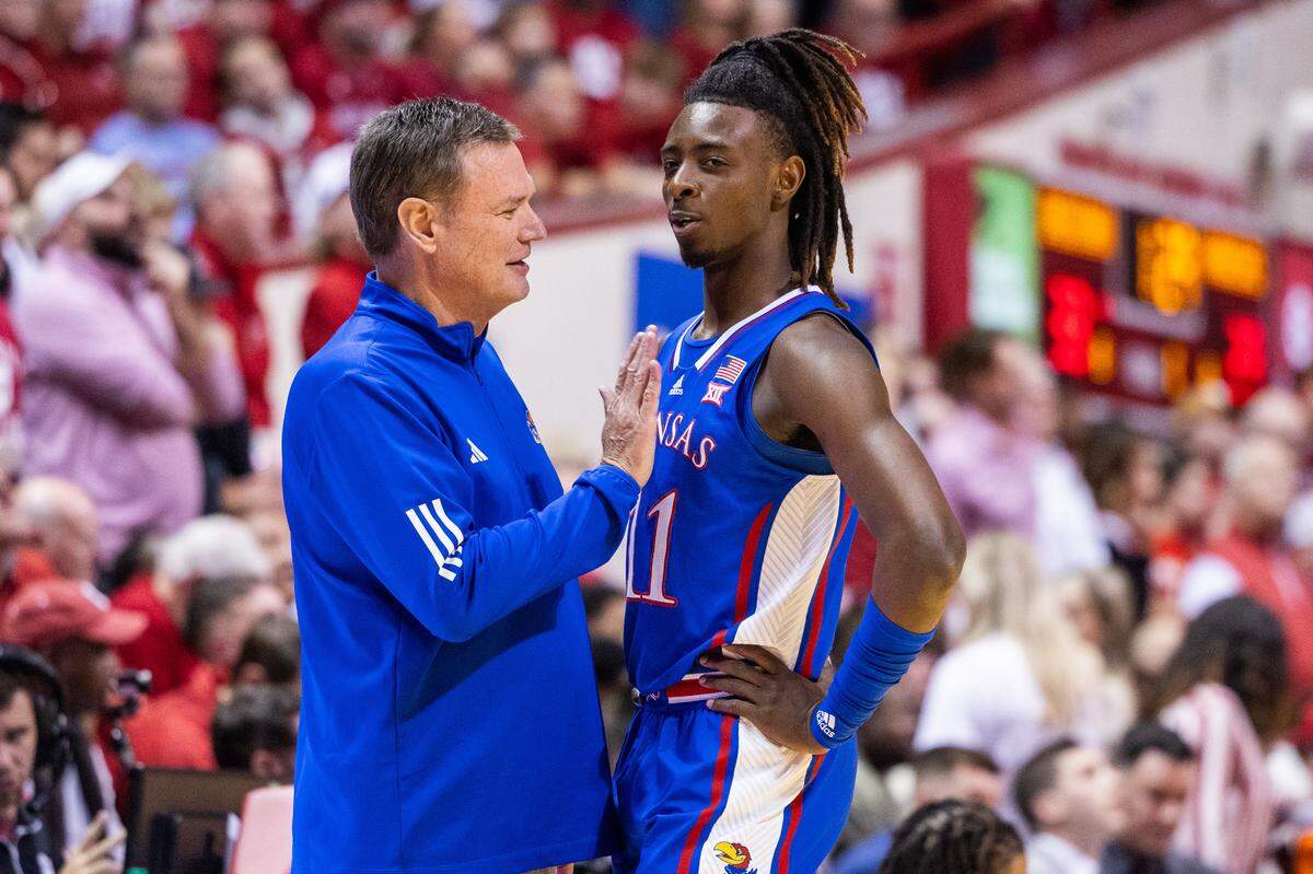Kansas Jayhawks coach Bill Self talks with guard Jamari McDowell (11) in the first half against the Indiana Hoosiers at Simon Skjodt Assembly Hall on Dec. 16, 2023.