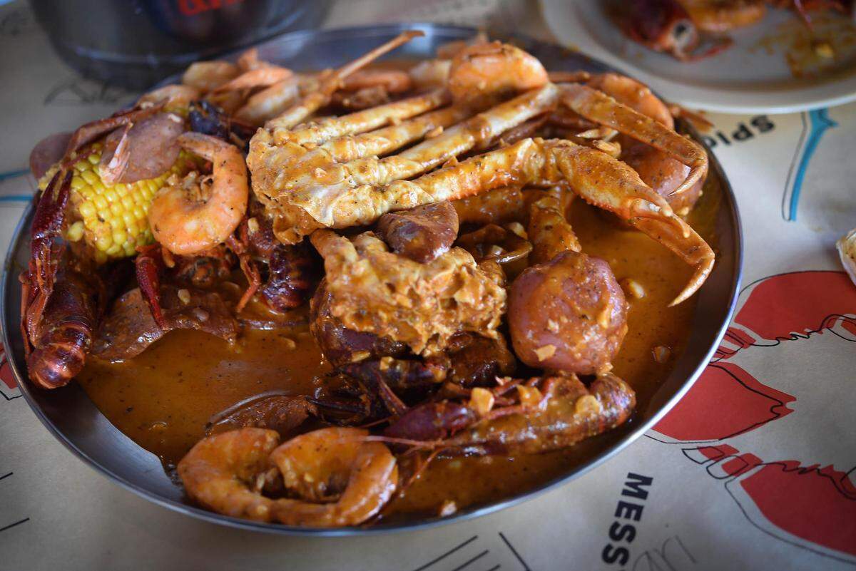The Reel Catch is a seafood boil combo featuring a crab leg cluster at Hook & Reel Cajun Seafood and Bar.