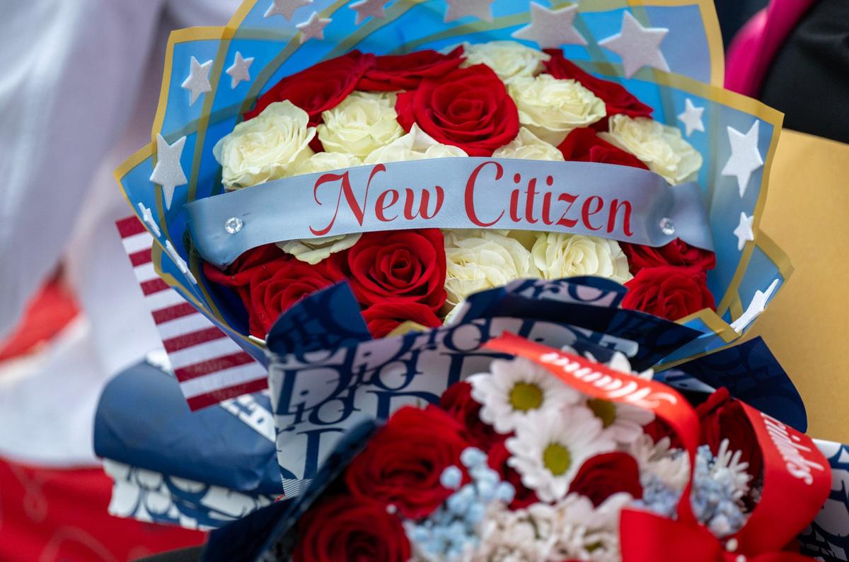 Zulma Salas received a special arrangement of flowers from family members at the citizenship ceremony.